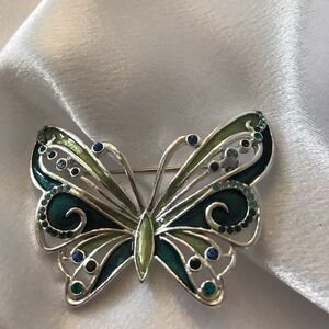 Butterfly brooch in green and teals on silver